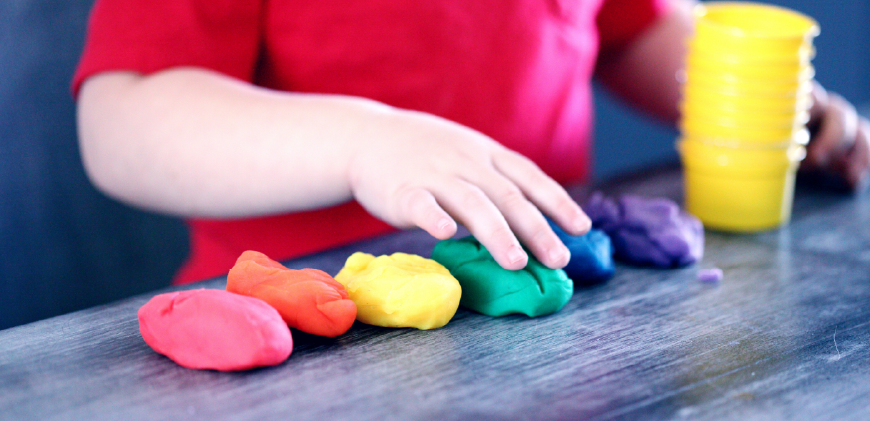 child playing with play-dough